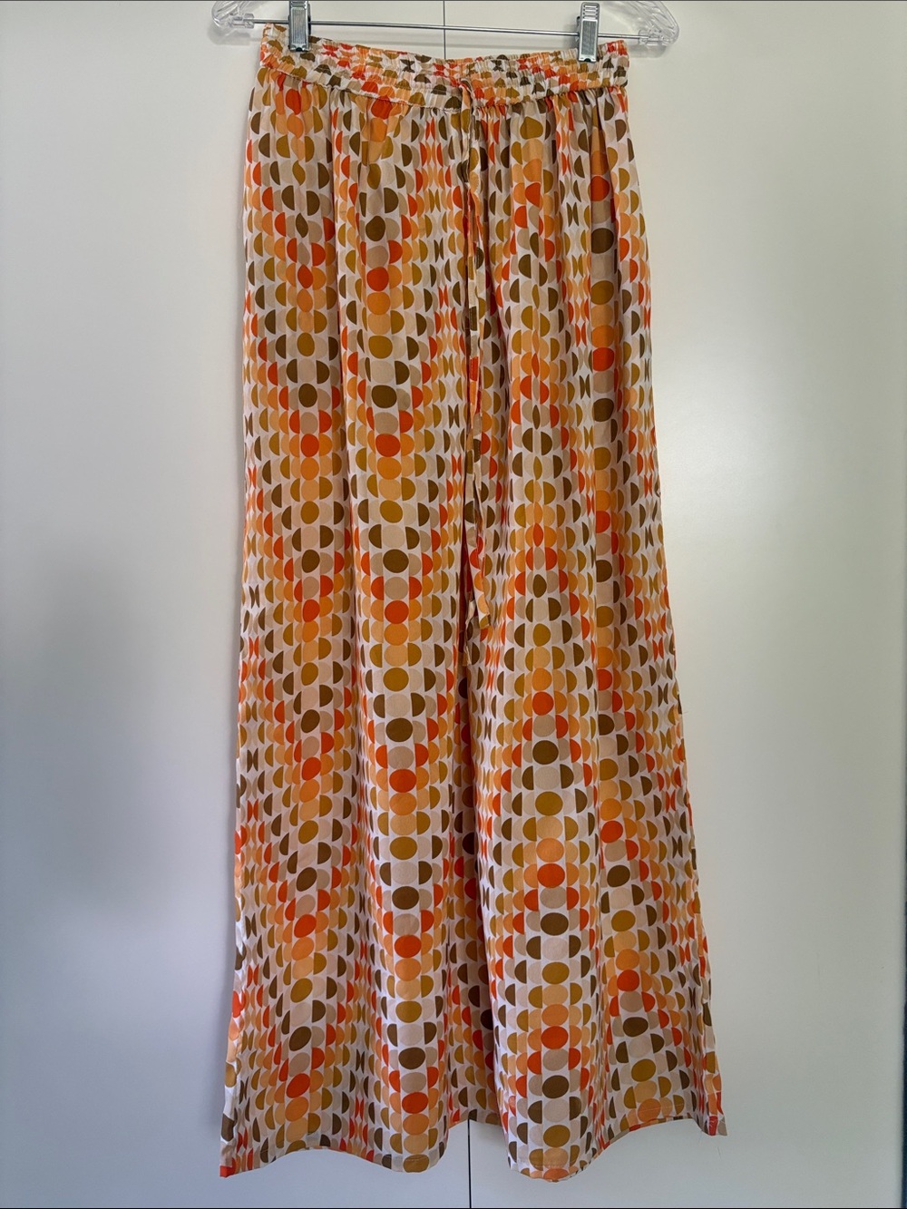 Belma palazzo pants feature a vibrant geometric pattern in orange and brown S